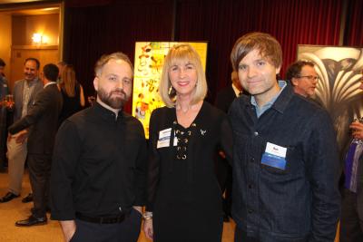 Nick Harmer and Ben Gibbard, with Deborah DeWees, executive director of the WWU Alumni Association.