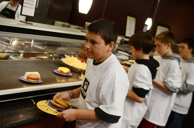 Students from Whatcom Middle School eat lunch at the Fairhaven College Dining Hall during a tour of the Western Washington University campus Thursday, May 26. The tour was a collaboration with the Woodring College of Education. Photo by Daniel Berman | Un