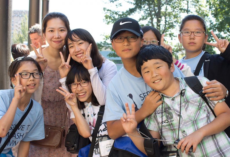 A group of students from Cheongju, South Korea, mug for the camera at a farewell ceremony Friday, Aug. 12, at Bellingham City Hall. Photo by Christopher Wood | University Communications intern