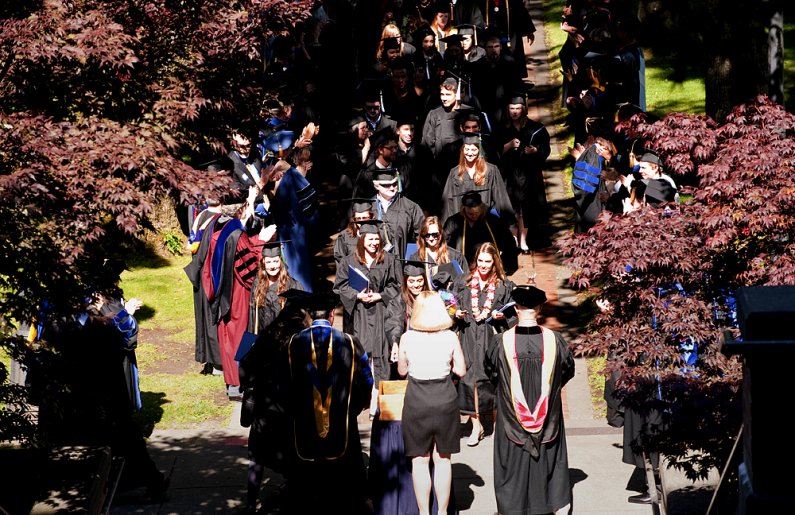 Summer graduates from Western Washington University line up to drop their mementos in the 2001 time capsule during the Memory Walk portion of the commencement ceremony on Saturday, Aug. 20, 2011. Photo by Tore Ofteness for WWU