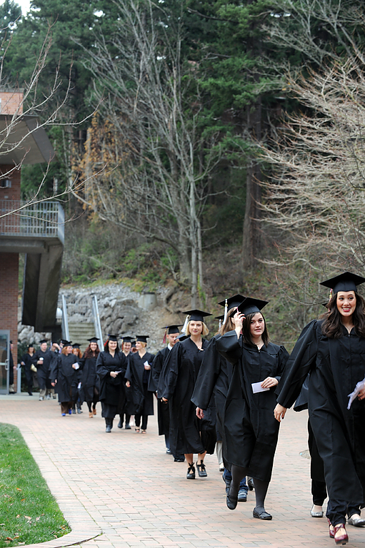 Graduates walk toward Carver Gymnasium from the SMATE Building before WWU commencement on Dec. 12, 2009. Photo by Rachel Bayne