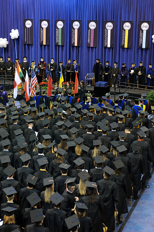 Graduates listen to the commencement speeches in Carver Gymnasium on Dec. 12, 2009. Photo by Rachel Bayne