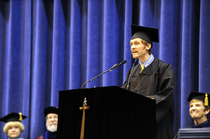 Student speaker Cody Gillin, who has a bachelor's degree in Environmental Science, speaks at 2009 fall commencement in Carver Gymnasium Dec. 12, 2009. Photo by Rachel Bayne