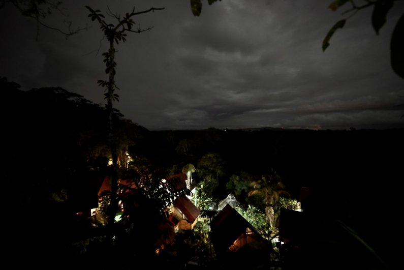The Yacuma Eco-Lodge lit up in the jungle at night.
