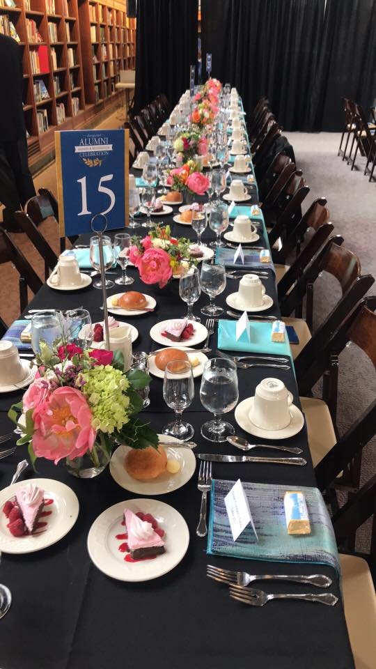 a banquet table is set for the awards event