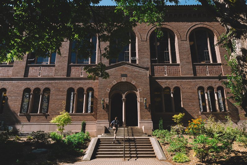 a person walks up the steps to the entrance to Wilson library