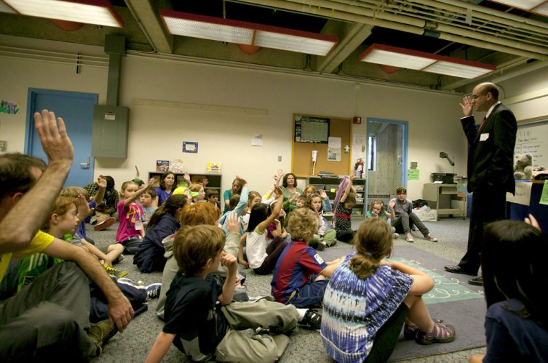 On his first day as the Bellingham School District's new superintendent, Greg Baker chats with schoolchildren on the Western Washington University campus. Baker, a WWU alumnus, was visiting the Western Kids Camp taking place in the Environmental Studies B