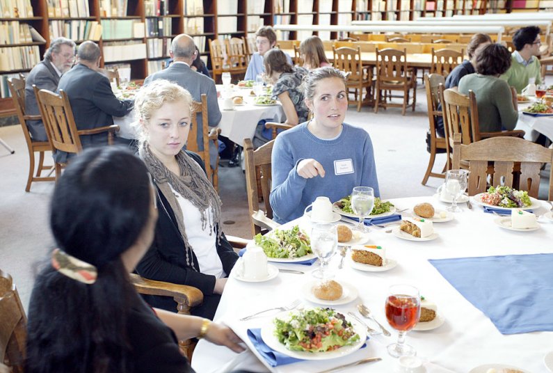 Students chat during a lunch seminar on foreign service in the Wilson Library Reading Room Thursday, May 26. Photo by Shea Taisey | University Communications intern