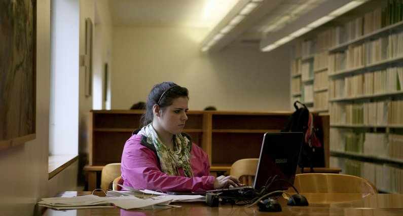 Western Washington University student Michelle Bohlke studies in Wilson Library during the last weeks of winter quarter. Photo by Matthew Anderson | WWU