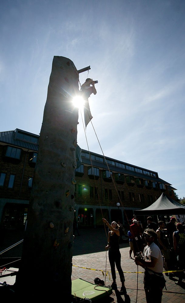 Western Washington University student Erin Nash, photographing for The Western Front, shoots from atop the Backcountry Essentials climbing wall at the info fair on Tuesday, Sept. 20, 2011. Photo by Matthew Anderson | WWU