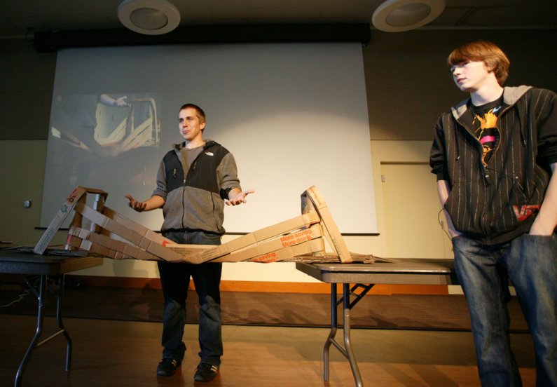 Western Washington University students Alex Dehn, left, and Jacob Newer-Thurber describe the bridge they built with the rest of their teammates during a bridge-building competition on the WWU campus Oct. 19, 2010. Photo by Matthew Anderson | University Co