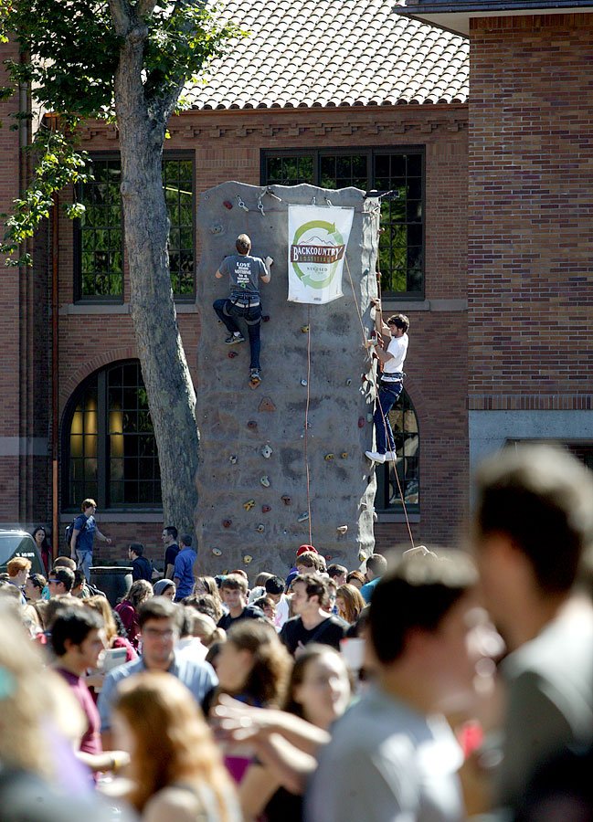Western Washington University students attack the climbing wall, provided by Backcountry Essentials, at the annual info fair in Red Square Sept. 20, 2011. Photo by Matthew Anderson | WWU