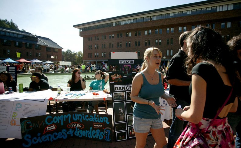 Western Washington University student Rachel McLachlan chats with fellow students interested in Western's theatre and dance department at the info fair on Sept. 20, 2011. Photo by Matthew Anderson | WWU