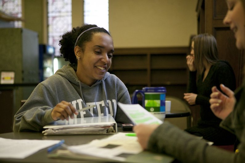 Lorryn Whisnant studies with a few of her friends, including Kathryn Kennedy, right, in Zoe's on the Western Washington University campus. Photo by Matthew Anderson | WWU