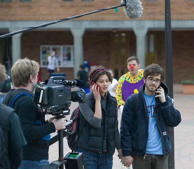 Western Washington University students Zoe Barnow, left, and Brian Arcement help a Canadian film crew shooting for the Canadian Broadcasting Company re-stage psychology Professor Ira Hyman's research in Red Square on Friday, Jan. 22. Photo by Matthew Ande
