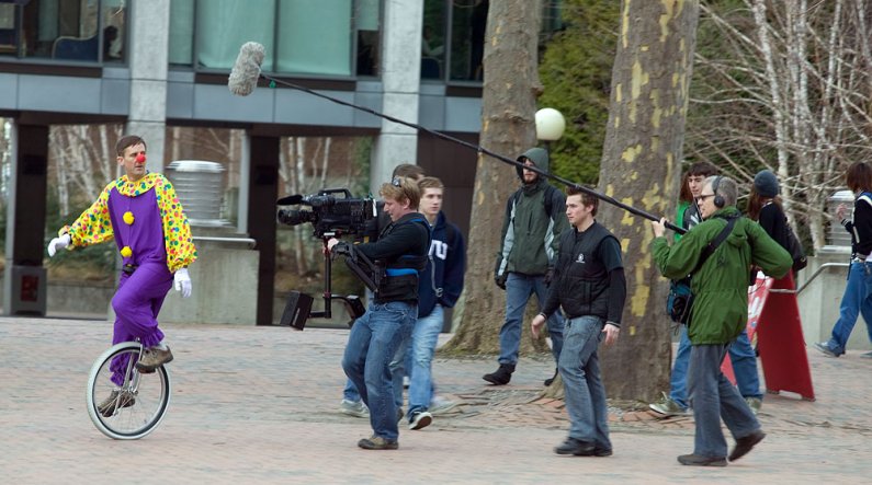 A Canadian film crew shooting for the Canadian Broadcasting Company films unicyclist Joe Myers, who works in WWU Facilities Management, on campus Friday, Jan. 22. The crew was on campus to re-stage research on cell phone use from psychology Professor Ira 