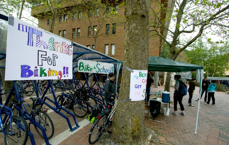 Colorful signs greet visitors to the celebration station set up near Red Square and Bond Hall on the northern end of the WWU campus Friday, May 21. Photo by Matthew Anderson | WWU