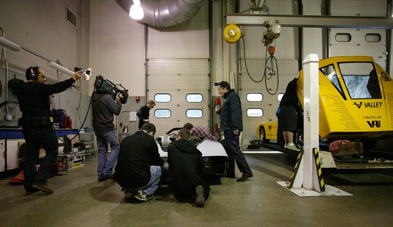 Peter Stützer, host of the German automotive program "Auto Mobil - Das VOX Automagazin," is filmed by cameraman Mike Lenzenbach in the VRI Thursday morning, Jan. 14. The show is set to air on Jan. 24. Photo by Matthew Anderson | WWU