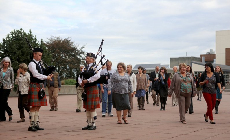 Bagpipers welcome faculty and staff to the Performing Arts Center for the annual Opening Convocation awards and a speech by President Bruce Shepard.