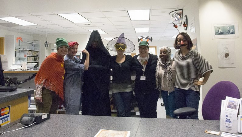 The Western Libraries' Resource Desk employees pose in their Halloween getup Wednesday, Oct. 31, before the library’s open house and scavenger hunt began. Photo by Maddy Mixter | Communications and Marketing intern