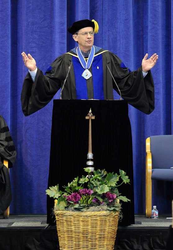WWU President Bruce Shepard speaks to the honored graduates at commencement March 19 in Carver Gymnasium. Photo by Dan Levine