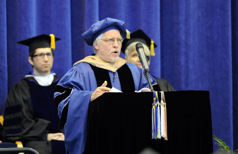 Scott Pearce, president of the WWU Faculty Senate, addresses the crowd assembled at winter 2011 commencement. Photo by Dan Levine
