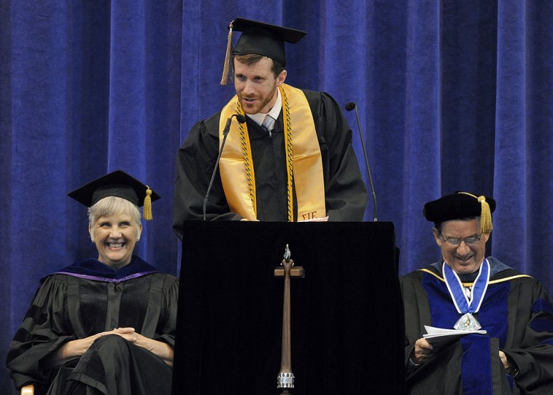 Student speaker Chris Crow gets laughs from provost Catherine Riordan, left, and president Bruce Shepard during his commencement speech June 11, 2011, at Western Washington University. Photo by Dan Levine | for WWU
