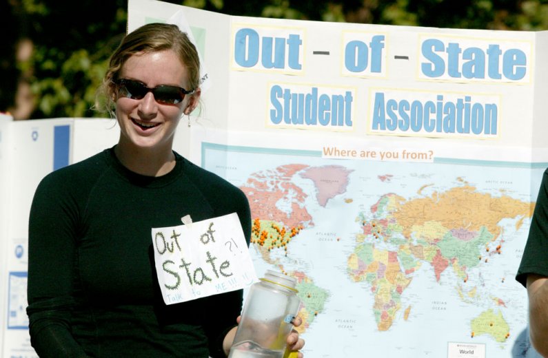 Leslie Gains-Germain chats with a prospective member of the Out-of-State Student Association during the Red Square Info Fair on Tuesday, Sept. 21. Photo by Matthew Anderson | University Communications