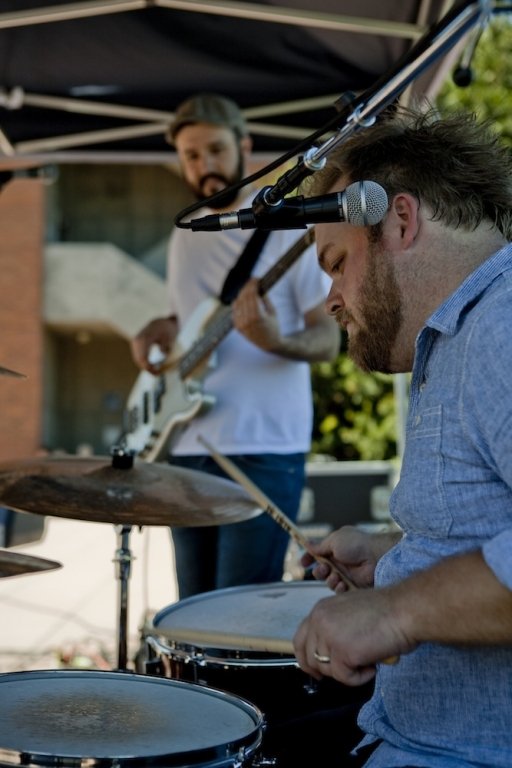 Drummer Brandon Shuman, 26, and bassist Sean Gasperetti, 26, of the band Washington Mile, hold the beat during Western's Summer Noon Concert series on Wednesday, July 7, 2010, in the Performing Arts Center Plaza. Photo by Brett Flora | University Communic