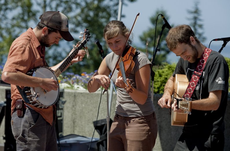 Nettle Honey plays acoustic bluegrass at the Performing Arts Plaza on Western Washington University's campus during the Noon Summer Concert Series on July 28, 2010. Johnny Fitzpatrick on banjo. Brittany Newell on fiddle. Colin Sterling on guitar/harmonica