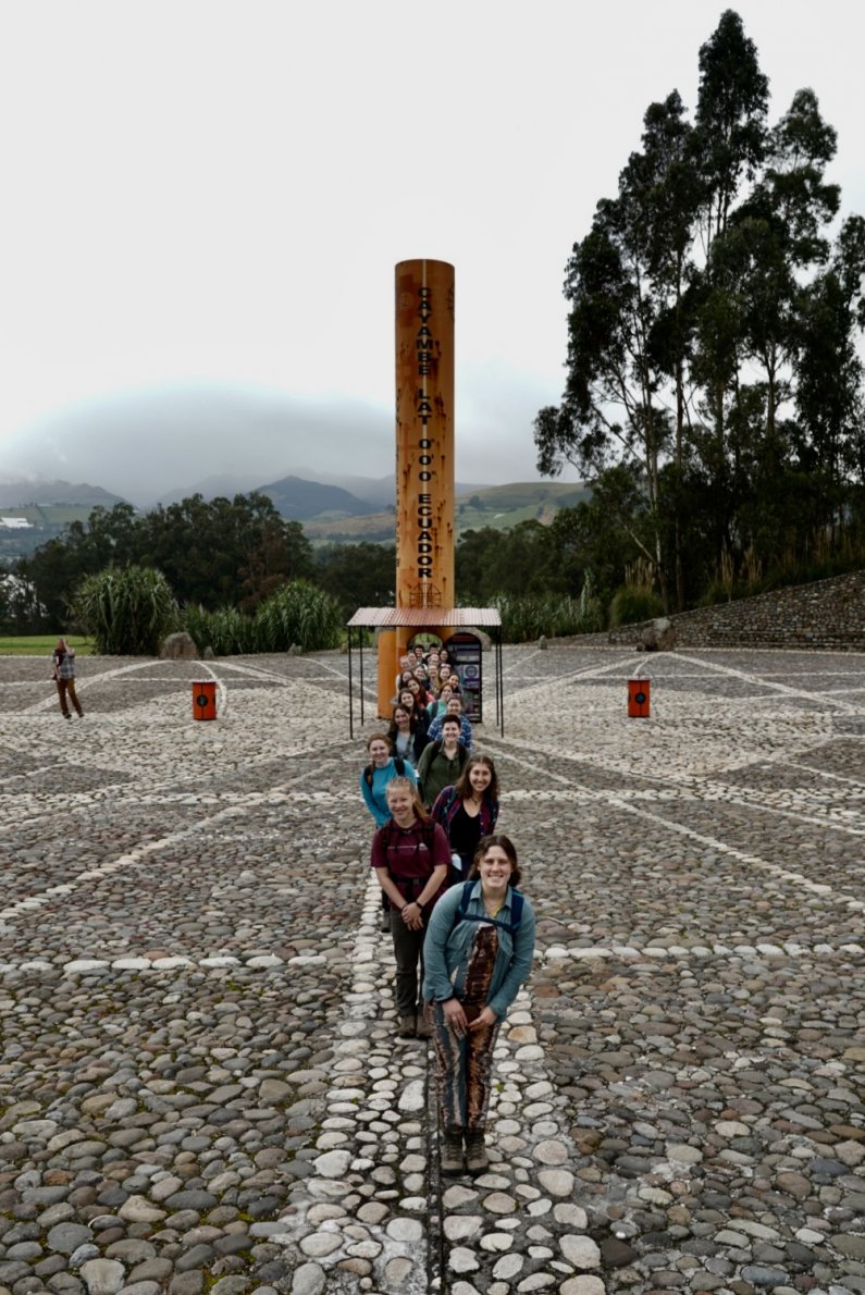 Students line up on the stones of the solar clock that rests exactly on the equator.