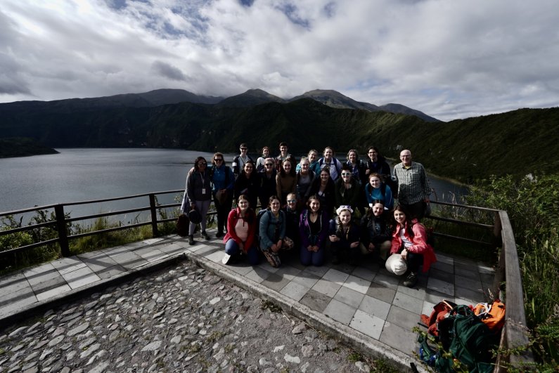 Students and instructors gather in front of the caldera of Cotacachi.