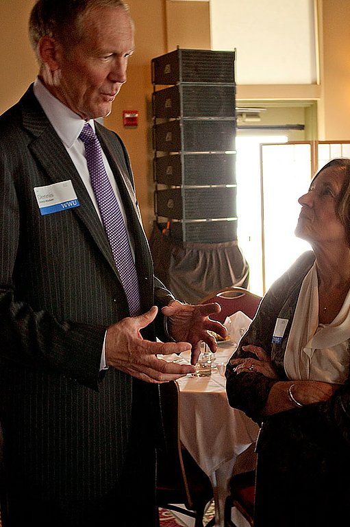 Dennis Madsen, a member of the Western Washington University Board of Trustees, talks with fellow Trustee Peggy Zoro at the ninth annual Bellingham Business Forum March 18 at the Hotel Bellwether in Bellingham. Photo by Laurie Rossman | WWU