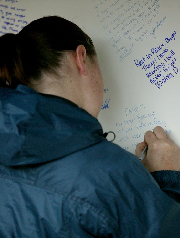 A Western Washington University student writes a message to Dwight Clark on Friday, Oct. 8, 2010. Photo by Matthew Anderson | WWU