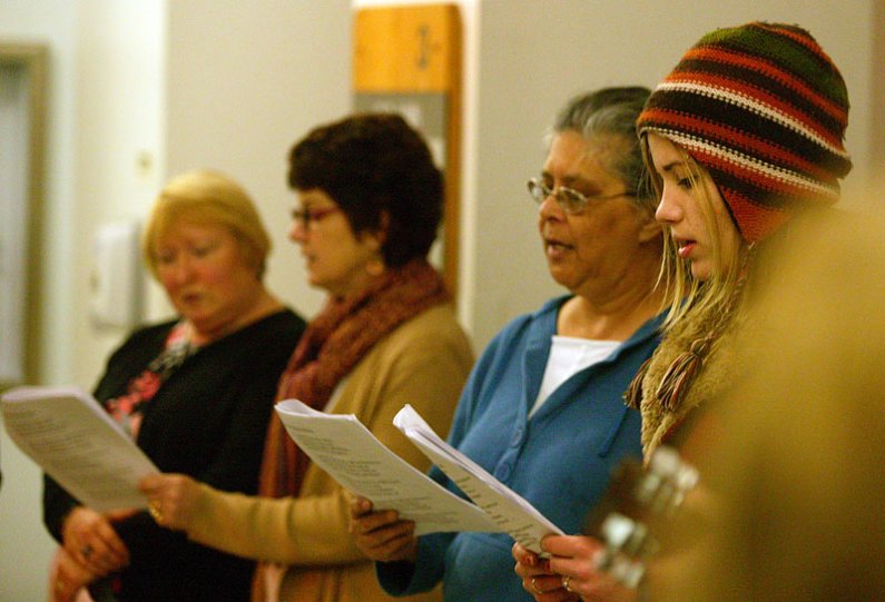 Members of the WWU singing group FM Singers fill the hallways of Old Main on Wednesday, Dec. 16, with Christmas carols. Photo by Matthew Anderson | WWU