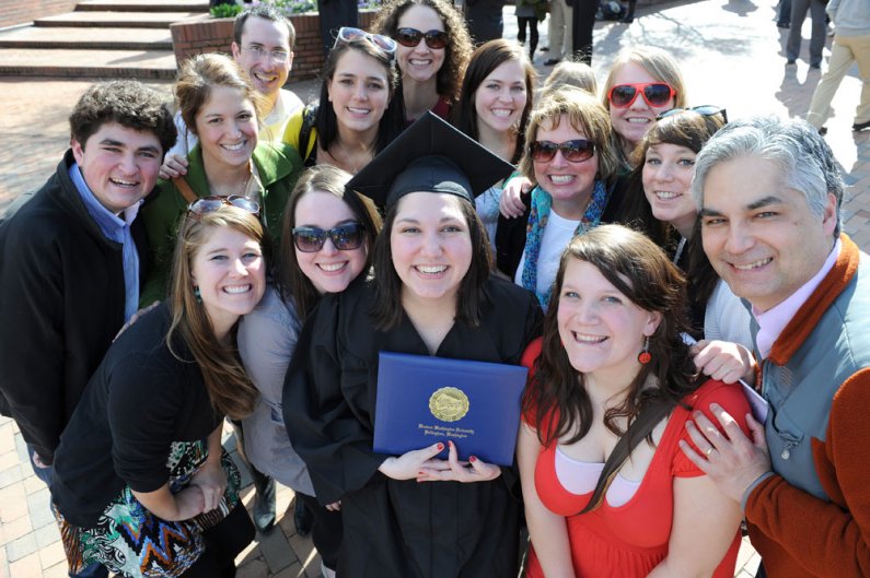 Graduating senior Erin Lawhead poses for a photo with her family after participating in winter commencement March 19 on campus. Photo by Dan Levine