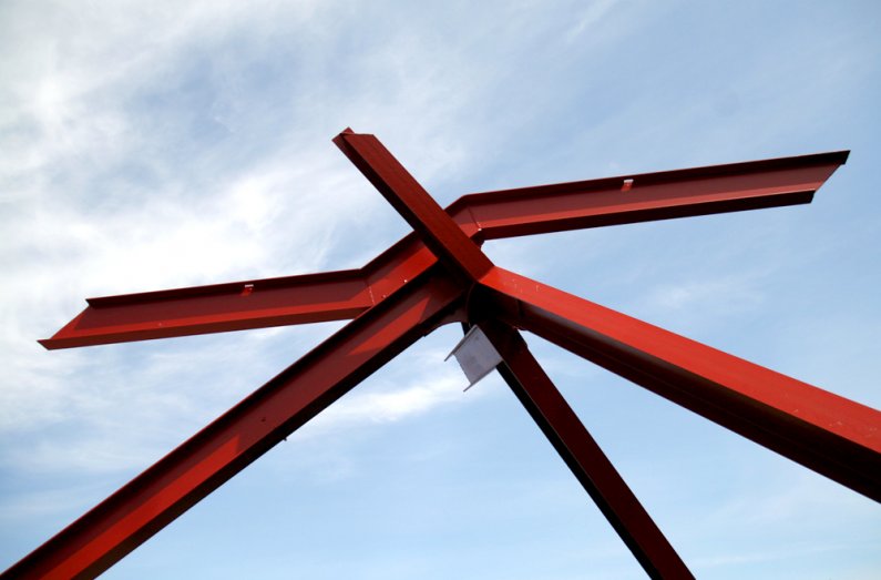 Artist Mark di Suvero's "For Handel" sculpture in the Performing Arts Center Plaza stands against a bright and sunny sky on Monday, May 10. Weather forecasters expect the clear weather to remain, warming up later in the week to the high 60s, with a possib