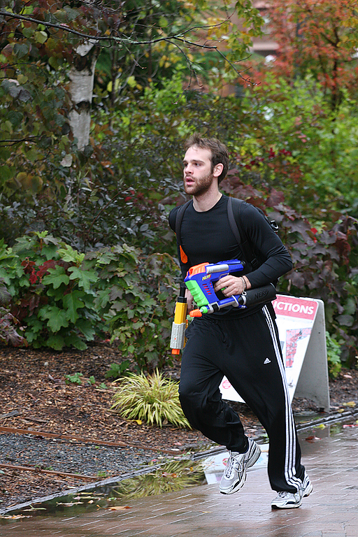 A student participating as a human in the Humans Vs. Zombies game runs through campus on Friday. Photo by Michael Leese | WWU intern
