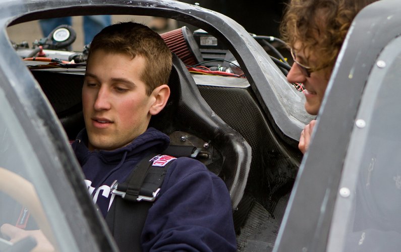 Brent Wise, left, chats with Eric Leonhardt prior to driving Viking 45 at Pacific Raceways April 20. Photo by Jon Bergman | University Communications intern
