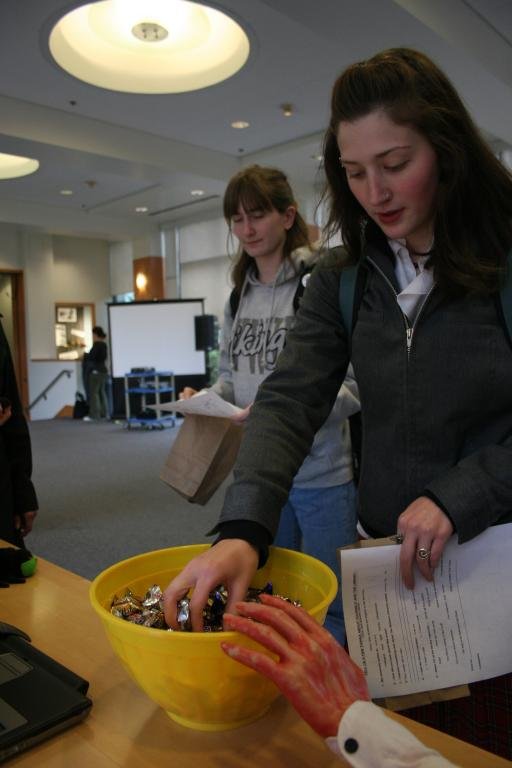Western Student Jessica Lynch, and English Literature major, reaches for a piece of candy during the Western Libraries' open house on Oct. 28. Photo by Michael Leese | WWU intern
