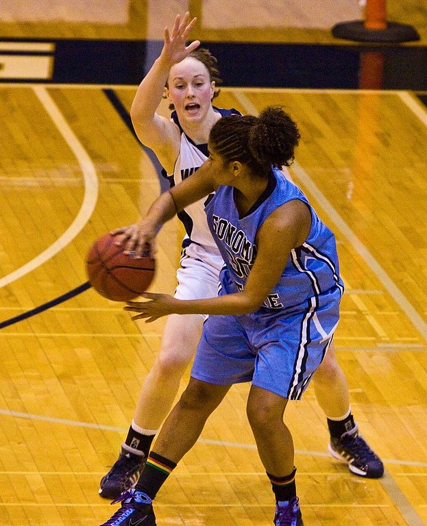 Amanda Dunbar guards Sonoma State's Oly Larkin during the GNAC/CCAA crossover tournament at Carver Gym Dec. 21. WWU won the game, 66-58, to move to 8-1 on the year. Photo by Jon Bergman | WWU intern