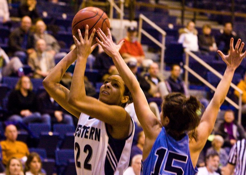 Krystal Robinson squares up for a jumpshot as Sonoma State's Jennifer Russo attempts to guard her. Photo by Jon Bergman | WWU intern