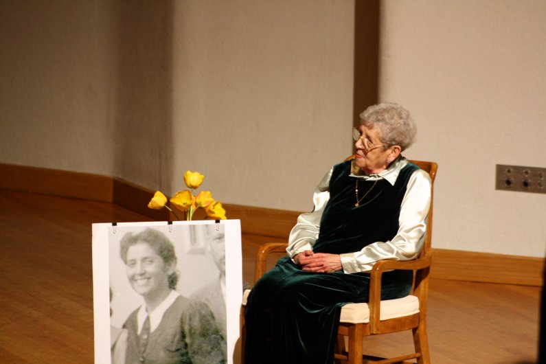 Noemi Ban, a Bellingham resident, award-winning teacher and survivor of the Holocaust, sits onstage at the April 27 ceremony held in her honor. Photo by Shea Taisey | University Communications intern