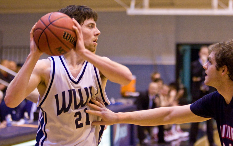 Sophomore forward Rory Blanche looks for an open teammate during the final minutes of Western's 81-73 victory on Tuesday, Dec. 29, in Carver Gym. Photo by Jon Bergman | WWU intern