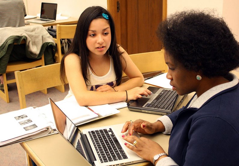 Arahmy Del Toro, left, and Josephine Coles, both juniors in the Health Education department, study in Wilson Library for their Health Promotion and Disease Prevention class final exam next week. Photo by Shea Taisey | University Communications intern