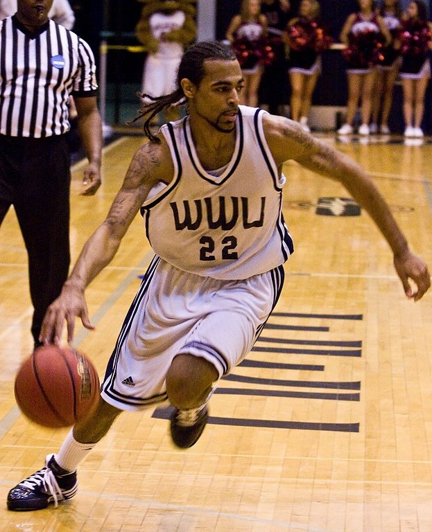 Vikings guard Morris Anderson dribbles the basketball into the waiting Wildcat defense. Anderson led all scorers with 23 points and four steals. Photo by Jon Bergman | University Communications intern
