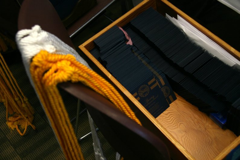 Honor cords and ceremony information await graduating seniors on Wednesday, June 9, 2010. Commencement exercises are set to take place on Saturday, June 12. Photo by David Gonzales | University Communications intern