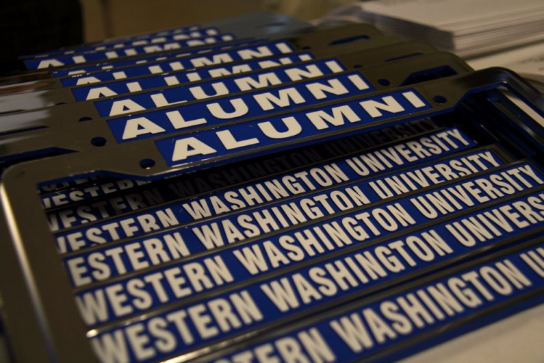 Seniors graduating from WWU are given free vehicle license-plate frames. Photo by David Gonzales | University Communications intern