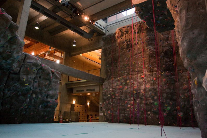Workers installed a new padded floor under the climbing wall in the Wade King Student Recreation Center on Friday, Oct. 23. The installation is an attempt to diminish injures from climbers falling onto inadequate padding. Photo by Jon Bergman | WWU intern