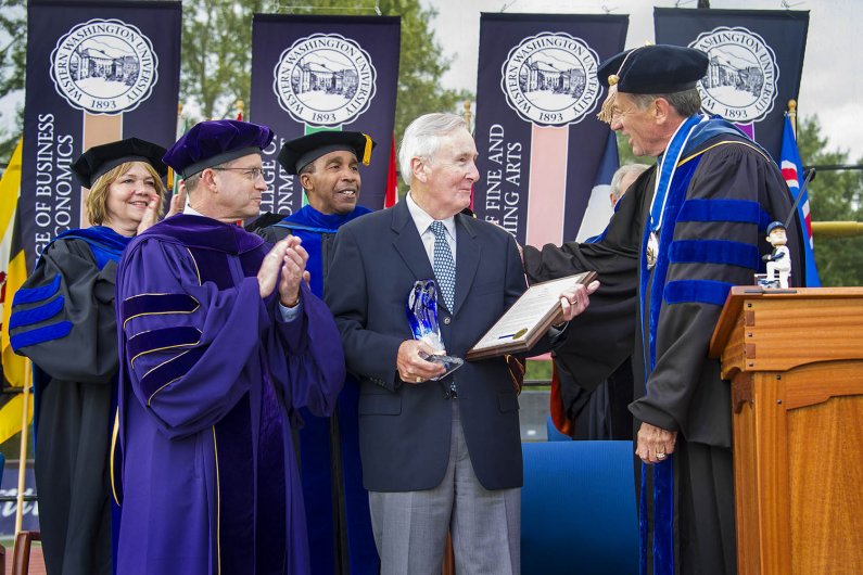 Bruce Shepard gives a President’s Award to Howard Lincoln for his service to Western and to the community. Photo by Dan Levine / for WWU